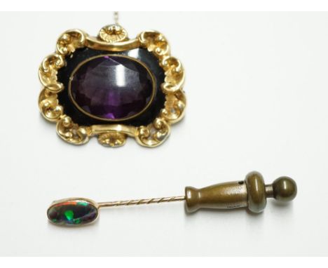 A Victorian gold plated and single stone oval amethyst paste set mourning brooch, 34mm, together with a yellow metal and blac
