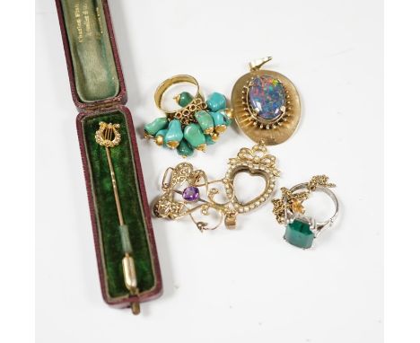 A group of jewellery including a yellow metal and seed pearl set stick pin, with lyre terminal and a 9ct and gem set pendant.