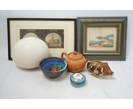A collection of cabinet curiosities, including miniature cups, an ostrich egg, a Japanese marbled pottery teapot, a sand pict