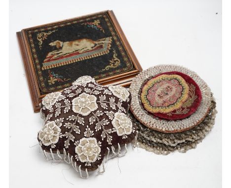 A 19th century framed needlework panel of a dog (possibly a teapot stand), a collection of bead worked mats, a beaded and tas