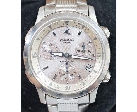 A modern stainless steel Casio Oceanus Wave Ceptor quartz wrist watch, on a Casio stainless steel bracelet, with original box