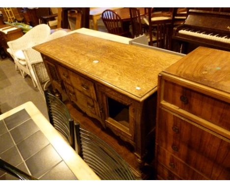 Light oak sideboard with under storage shelf, twin cupboards and two central drawers, 150 x 57 cm