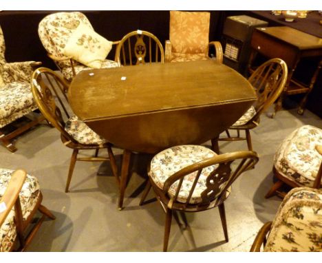 Ercol drop leaf dining table and four fleur de lys stick back chairs