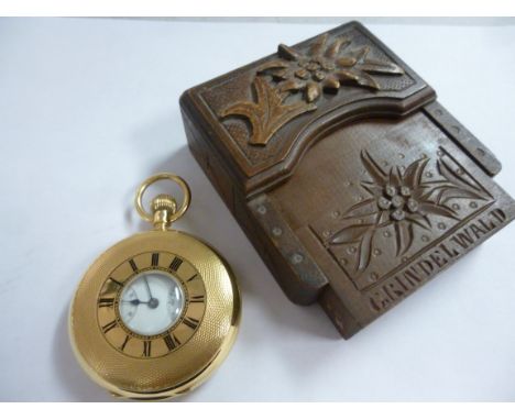An 18ct gold engine turned gold cased half hunter pocket watch, decorated with black enamel Roman numerals around the bullsey