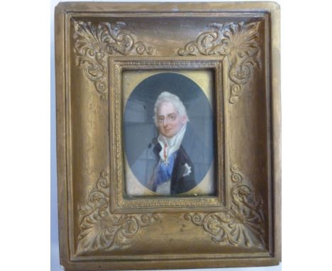 An early 19thC head and shoulders oval portrait miniature, a man wearing a topcoat and cravat, a sash and ambassadorial order