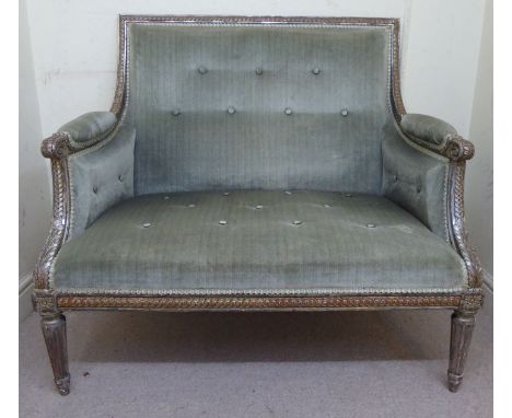 A late 19thC French Louis VI style silvered, guilloche and acanthus carved, showwood framed small salon settee with a level b