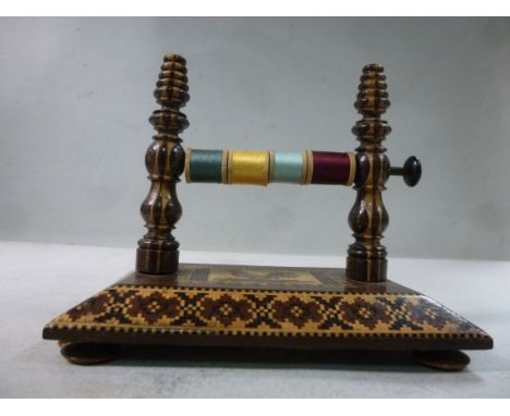 A Tunbridgeware needleworker's reel stand, the pair of pillars set on a chamfered platform and button feet  5''w