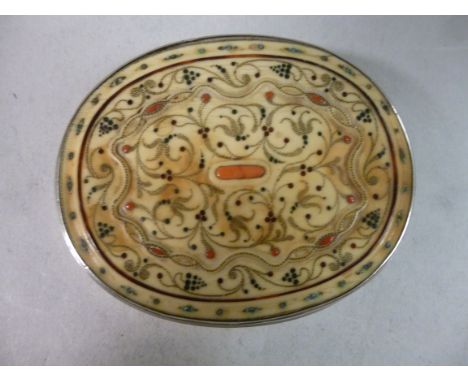An 18thC (possibly) Persian silver oval, shallow box with a plain ivory base panel, the ivory cover decorated with carved, na