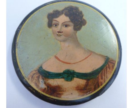 An early 19thC round, shallow, black lacquered papier mache snuff box, the cover featuring the head and shoulders portrait of