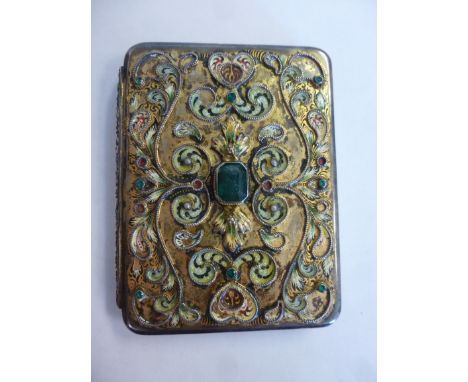 An early 20thC Hungarian silver gilt cigarette case with cast and applied green stones, scrolled wire, painted enamel and eng