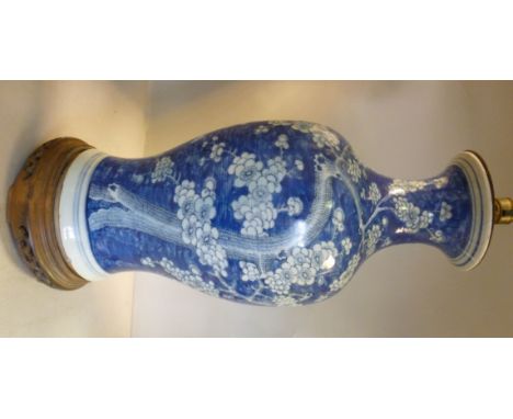 A late 19th/early 20thC Chinese porcelain vase design table lamp of waisted baluster form, having a narrow, flared neck, deco