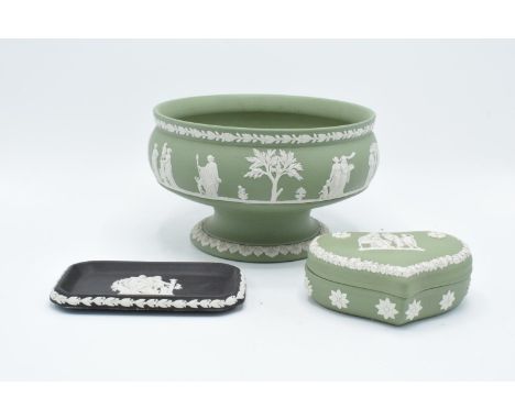A collection of Wedgwood jasperware to include a sage green footed bowl, a heart shaped trinket box and a black pin tray (3).