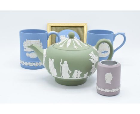 A collection of Wedgwood Jasper ware to include a lilac vase/ table lighter, a sage green teapot (spout a/f), 2 tankards and 