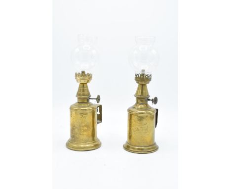 A French brass lamp Une Lampe Pigeon together with a similar item Lampe Feautree Olympe (2). With associated chimneys. 24cm t
