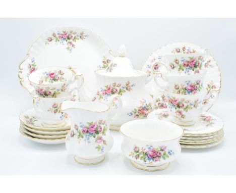 A collection of Royal Albert items in the Moss Rose design to consist of a large teapot, milk and sugar, 5 cups, 4 saucers, 6
