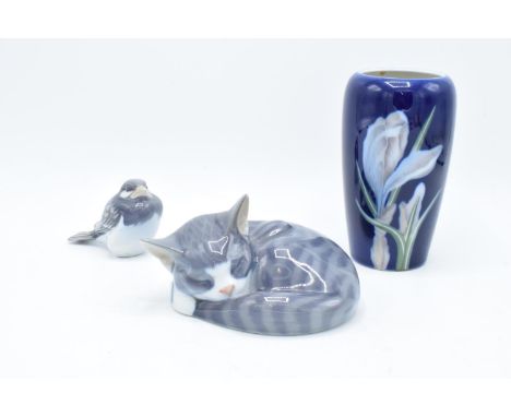 A collection of Royal Copenhagen to include a sleeping cat 057, a bird 107 and a floral vase 1590/747 (3). In good condition 