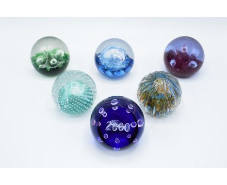 A collection of Caithness paperweights to include Moonflower, Cauldron, Moonflower, Millennium, Quicksilver and Optix (6). In