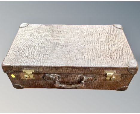 A vintage faux crocodile skin luggage case 