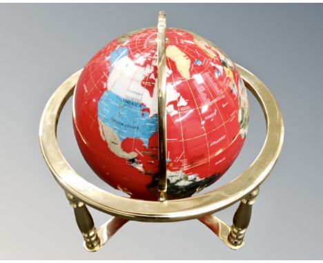 A gemstone globe on brass stand. (height 41cm)