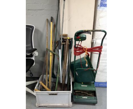 A Qualcast electric lawn mower with grass box together with a plastic tub containing a good selection of garden tools 