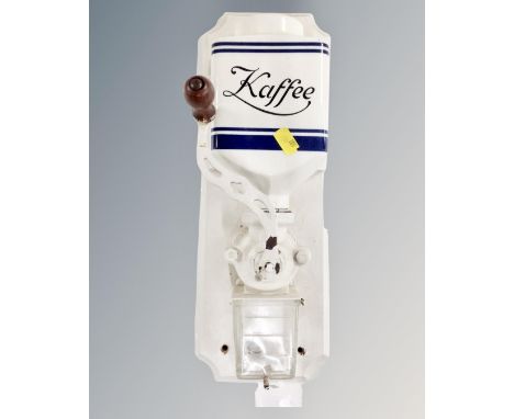 A vintage continental wall mounted coffee grinder 