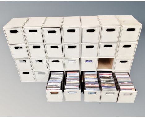 Fourteen cream faux leather two-drawer CD chests (seven drawers containing CD's)