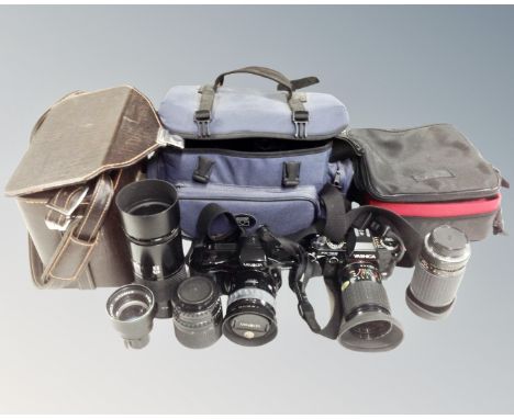 A box containing Minolta Dynax 7XI camera, Yashica FX-103 camera, assorted lenses and camera bags.