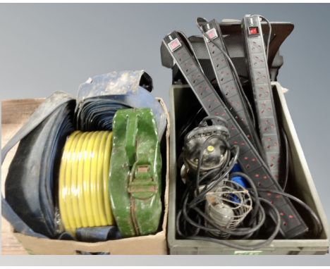 Two boxes of hose, fire hoses, petrol can, inspection lamp, three combo 10 socket extension leads 110v