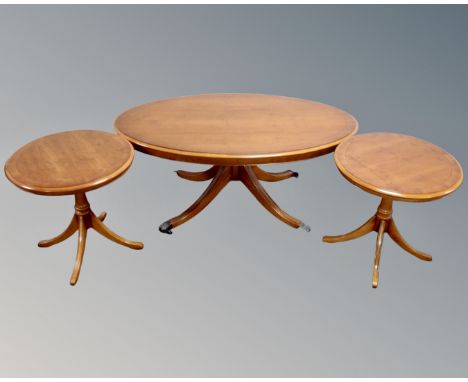 A Bradley Furniture Yew wood oval pedestal coffee table together with pair of matching lamp tables 