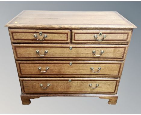 A George III inlaid oak five drawer chest on bracket feet, 104cm wide by 52cm deep by 90cm high. 