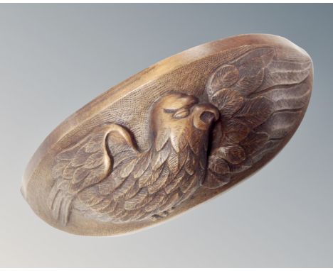 A carved beech wall bracket depicting a bird in flight. (width 22cm)