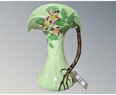 A Carlton ware decorative jug, modelled in the form of a blossoming tree with the trunk forming the handle, height 27cm.