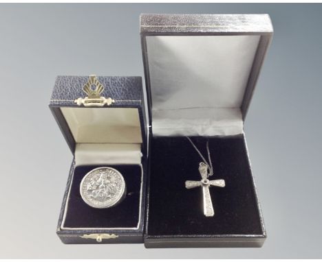 A gent's silver signet ring inset with a coin, and a silver crucifix pendant 