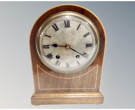 An Edwardian mahogany satinwood inlaid 8 day mantel clock with silvered dial