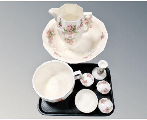 An eight piece antique Scotch Ivory wash jug and basin, chamber pot and dressing table set