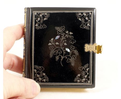 A Rare Book-Form Double Daguerreotype Case with Portraits. Inlaid with mother-of-pearl to the front with a metal clasp. Conta