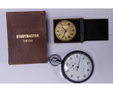  A Jaeger LeCoultre mechanical travelling clock in a black enamelled metal case, together with a Breitling Studymaster stop w