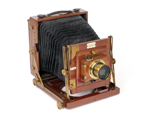 A Sanderson Half Plate Field Camera (bellows need cleaning/attention, otherwise condition 5F). Stamped 19 to the underneath. 