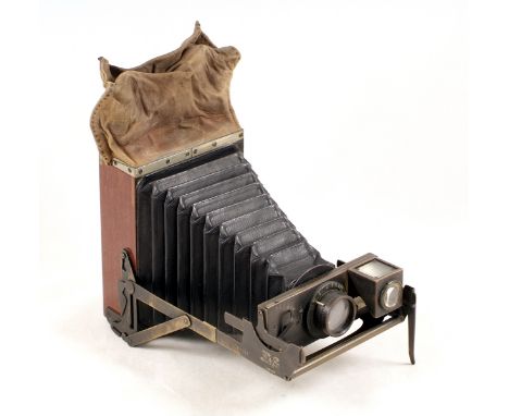 An Uncommon Newman &amp; Guardia Folding Nydia plate camera #354421 (condition 5F) with a single 9x12cm plate holder.