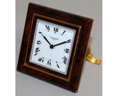 A SMALL CARTIER SQUARE ENAMEL FRAMED CLOCK.  2.5ins.