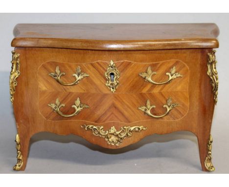 A MINIATURE LOUIS XVI DESIGN BOMBE FRONTED COMMODE JEWELLERY BOX with ormolu handles and mounts.  13ins wide.