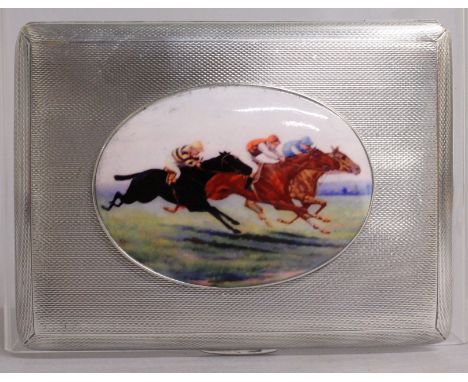 AN ENGINE TURNED CIGARETTE CASE with a horse racing scene. Chester 1920.