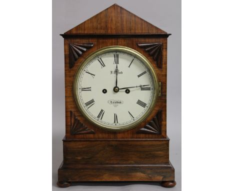 A LATE REGENCY ROSEWOOD BRACKET CLOCK by J. WOOD, LONDON, with white dial, eight-day movement, brass grilled sides, supported