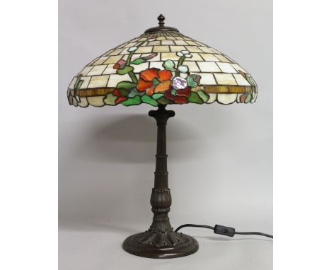 A GOOD "TIFFANY" BRONZED BASE LAMP with floral leaded shade. 25ins high.