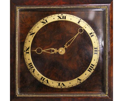 A SQUARE BEDSIDE CLOCK.