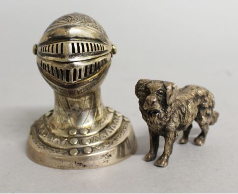 A VICTORIAN NOVELTY SILVER SALT, as a man wearing a HELMET, London 1900, Maker: George Unite, and a CAST SILVER DOG (2).