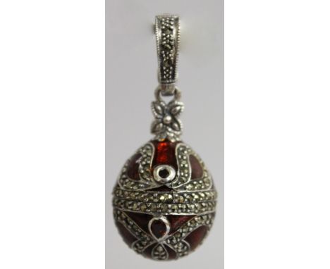 A SILVER AND ENAMEL "FABERGE" EGG PENDANT.