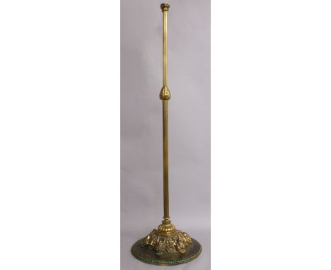 A BRASS STANDARD LAMP.
