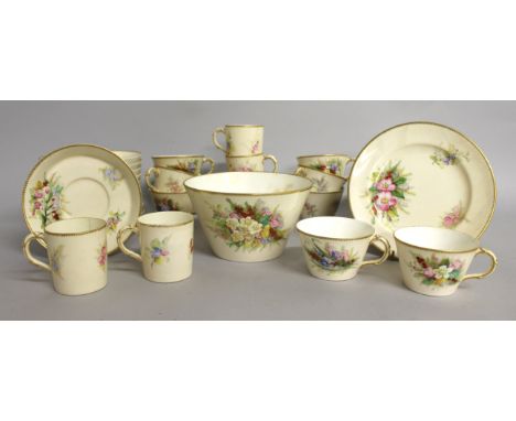 A ROYAL WORCESTER CREAMWARE PART TEA SET painted with flowers, comprising eleven 7-inch tea plates, eight tea cups, five tea 