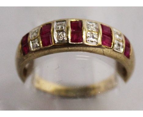 A 9CT YELLOW GOLD RUBY AND DIAMOND HALF HOOP RING.